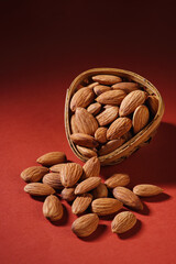 Indian dry fruits called almonds isolated on dark background 