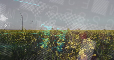 Floating digital HUD overlays hovering over yellow flowering field at farm, with wind turbines