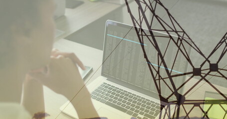 Gazing woman resting chin on hand studying laptop code with network overlay at office, copy space