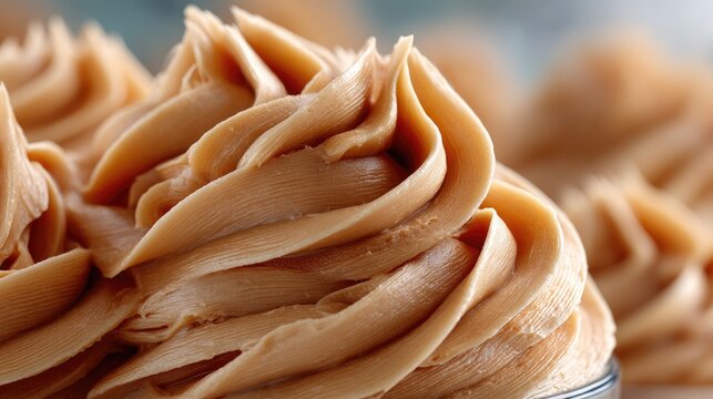 Rich and creamy buttercream frosting swirls displayed on a dessert table at a baking competition during the afternoon