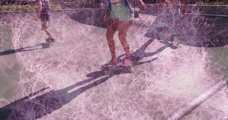 Balancing female skateboarder in green shorts in skatepark bowl, with smartphone and chalk dust
