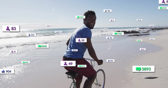 Riding man pedaling bicycle with drop handlebars along wet sand shore, with social media overlays