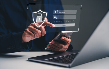 A person logging into a digital platform using a smartphone, with a focus on security through a virtual lock and login interface displayed on a laptop.