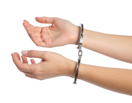 Handcuffed hands with open palms showing restraint and surrender