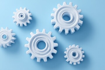 White gear cogs on light blue background