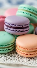 Fototapeta premium Colorful macarons stacked on a lace doily.