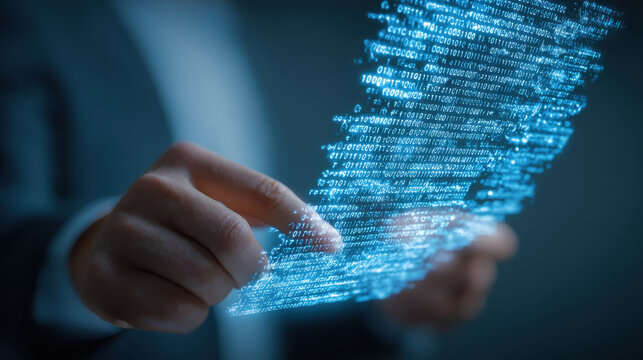 Person interacts with digital hologram displaying binary code, symbolizing technology and innovation in data management. image conveys futuristic approach to digital information handling