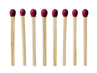 Eight wooden matches with red tips neatly arranged in a row, highlighting a simple yet essential tool for ignition.