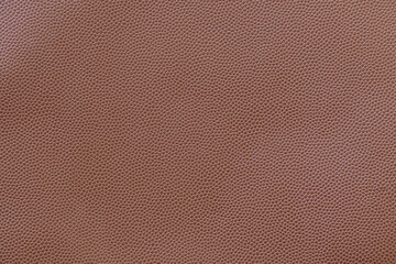 Brown synthetic leather embossed in small dots for background
