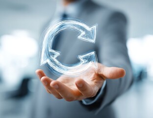 A man's hand holding a glowing digital circular arrow symbol