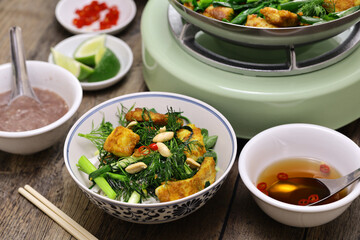 fried turmeric marinated river fish with dill, homemade Vietnmese cuisine