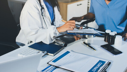 Young brunette woman having consultation at doctor office during