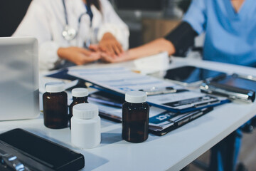 Doctor checking patient arterial blood pressure in hospital. Health care Concept