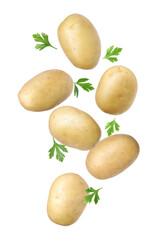 Fresh raw potatoes with parsley falling on white background