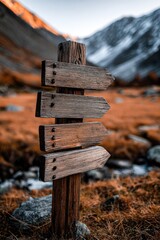 Scenic travel signpost in mountainous landscape at dusk with golden hues