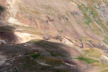 Arid Volcanic Valley with Colorful Layers and Erosion Patterns