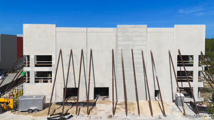 Precast concrete wall panels building construction with steel support columns.