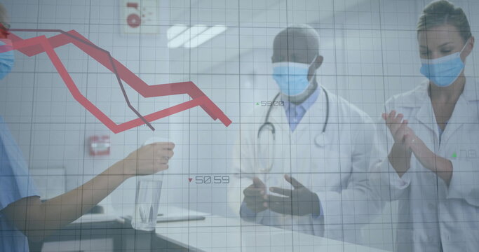 Standing masked team examining red line graph behind lab counter, with clear vial and grid overlay - Powered by Adobe