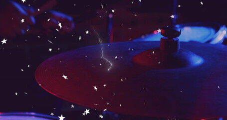 Drum cymbal glowing under red and blue music stage lights with stand, felt-washer bolt, star lights