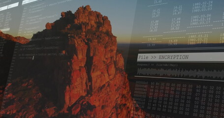 Displaying code on rugged cliff at sunset, with File  ENCRYPTION progress bar and hex dump