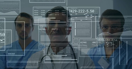Medical team analyzing translucent data panels in hospital corridor, showing graphs and code