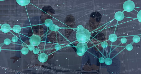 Collaborating corporate team reviewing documents and laptops at conference table, with data overlay