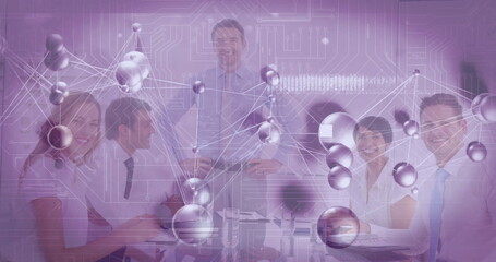Group professionals collaborating around conference table in meeting room, with digital overlay