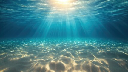 Fototapeta premium Sunlight streams through serene, deep blue water, illuminating the sandy bottom, creating a tranquil underwater scene.