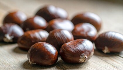 Close-up shot of raw chestnuts on a wooden table, showcasing natural textures, shiny brown shells, and organic autumn harvest theme, perfect seasonal background for food and nature photography