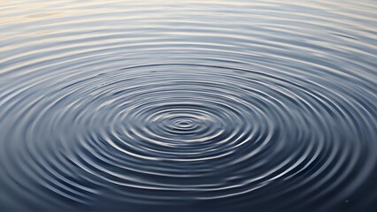Fototapeta premium Calm Water Surface with Circular Ripples Under Soft Natural Light