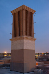 Wind tower standing tall in Yazd, Iran at sunset