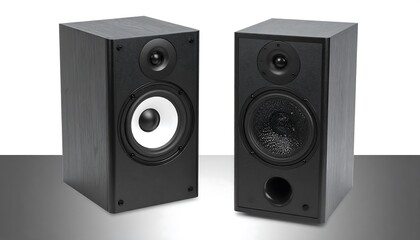 Pair of black speakers against gray backdrop