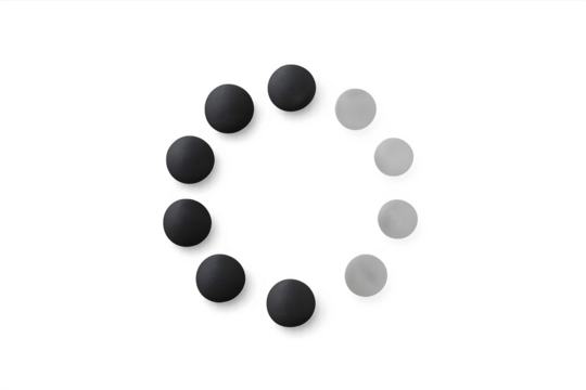 A circular arrangement of alternating black and white spheres. Concept Circular Arrangement, Alternating Colors, Black and White Spheres, Symmetrical Design, Visual Contrast