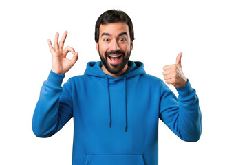 Fototapeta premium Excited bearded man in blue hoodie gives thumbs up and ok gesture transparent background