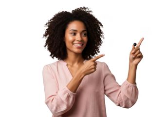 Joyful young woman with curly hair points to the side with both hands smiling brightly transparent background