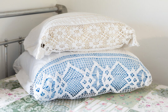 Crocheted pillowcases on an iron bed in the USSR