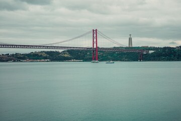 Fototapeta premium Scenic view of the 25 de Abril Bridge in Lisbon, Portugal.