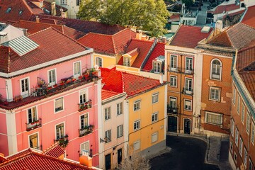 Aerial view of colorful buildings with red roofs in Lisbon, Portugal.