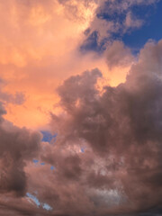 Fototapeta premium Dark pink and orange dramatic clouds background.