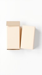 Obraz premium Two light beige square blocks or cubes isolated on a clean white background studio shot