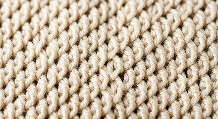 Close-up of soft beige knitwear with a distinct pattern