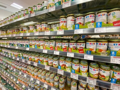 Santa Ponsa, Spain - August 20, 2025: Shelves filled with colorful baby food jars from HiPP brand in a grocery store, showcasing variety and nutrition for infants and toddlers
