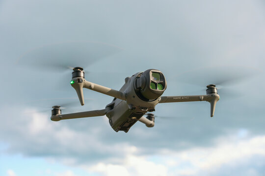 The DJI Mavic 4 Pro drone hovers mid-air, capturing stunning 6K aerial footage with precision, stability, and advanced flight controls.