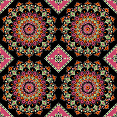 Symmetrical bliss of floral mandalas in vibrant hues creating an ornate meditative pattern on black