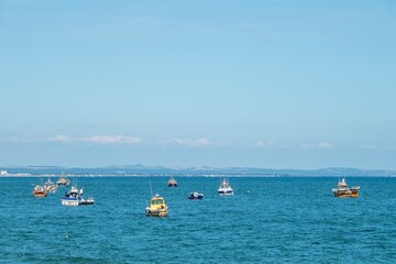 Obraz premium Selsey England - August 24 2025: fishing boats in the sea at Selsey West Sussex