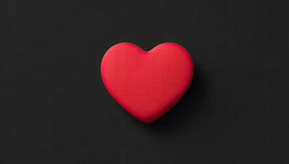Obraz premium A vibrant red heart shape on a dark background (1)