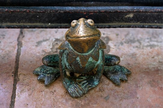 Budapest, Hungary - July 08, 2024: Small bronze figurine of a Muppet Kermit the Frog created by Mihaly Kolodko.