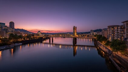 Obraz premium City skyline at dawn, bridge over river