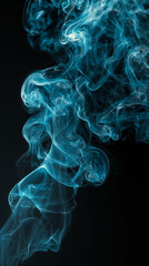 Fototapeta premium Abstract ethereal blue smoke gracefully swirls and dances against a dark backdrop, creating a mesmerizing visual experience. 