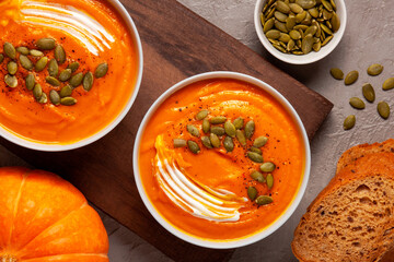 Pumpkin soup with seeds and spices close-up